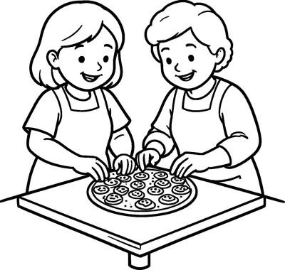 A girl and her grandmother in aprons lean over a tray of smiley-face cookies.