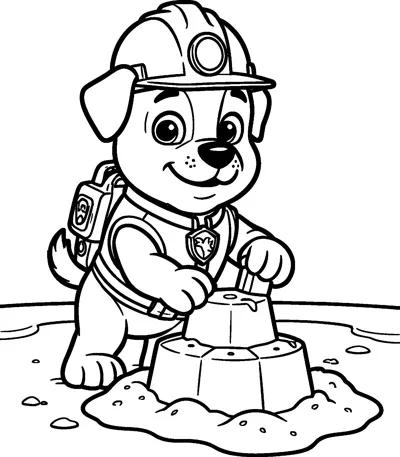 Rubble pats down a sandcastle on the beach with a spade, wearing his hard hat, vest, badge and pup-pack.